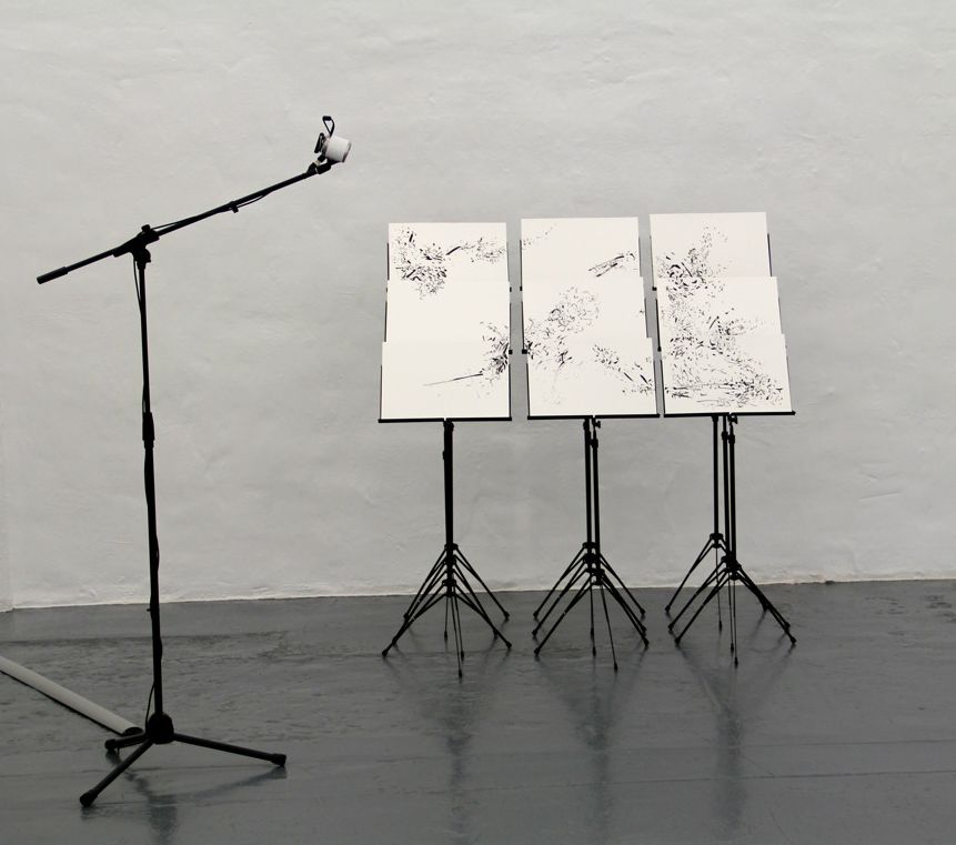 Click the image for a view of: Without Time and Place  installation II. 2012. Brush and ink drawings, music stands, speaker
